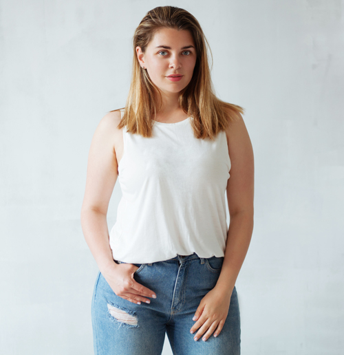 Curvy Woman Wearing Jeans and White Top