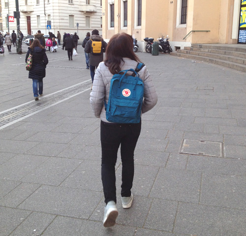 woman wearing a fjallraven kanken backpack