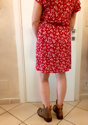 woman wearing brown ankle boots and red floral dress